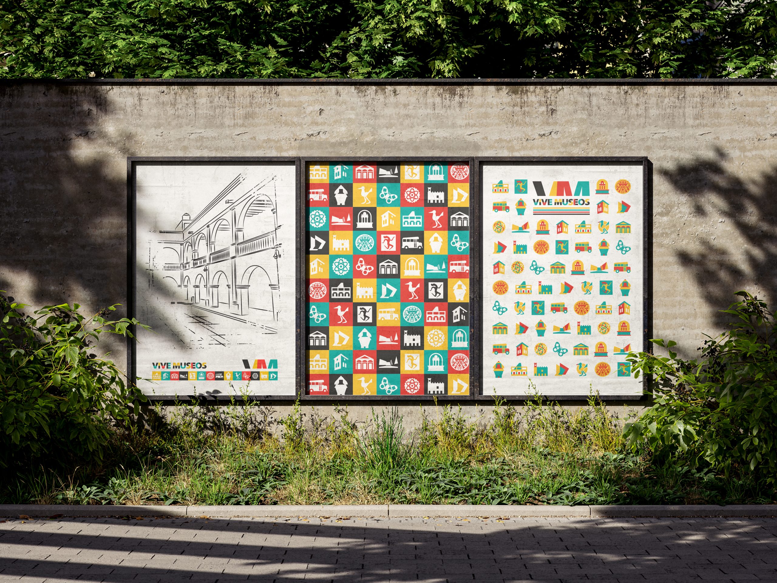Wall outdoors displaying three colorful posters for the Vive Museos program